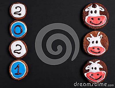 New Year 2021 background. Gingerbread cookies with numbers and cows Stock Photo