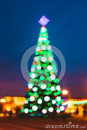 New Year Boke Lights Xmas Christmas Tree And Festive Illumination. Defocused Blue Bokeh Background Effect. Design Stock Photo