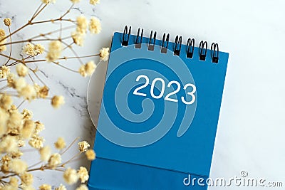 New Year 2023 Calendar flat lay with flower Stock Photo