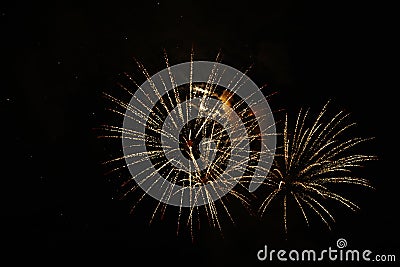 New Year celebration fireworks. Fourth of July Fireworks. Fireworks light up the sky with dazzling display. glowing Stock Photo