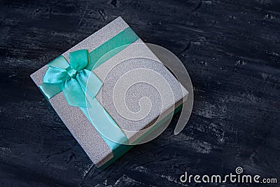 Silver Glitter Christmas Gift Box with turquoise bow Stock Photo
