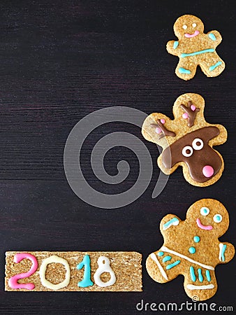 New Year and Christmas background. Gingerbread cookies are framing the background Stock Photo