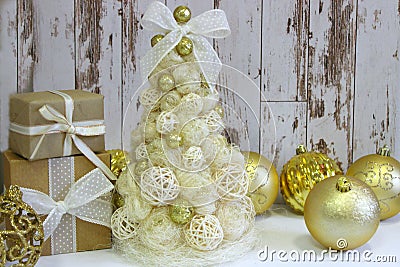 New year, Christmas card.New Year, Christmas background, rustic style. Festive Christmas tree in gold on white wood background and Stock Photo