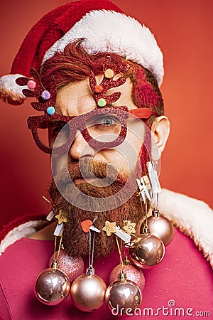 New Year, Christmas card. Santa portrait for banner or greeting poster. Bearded crazy Santa looking at the camera Stock Photo
