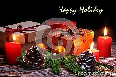 New Year or Christmas decorations with gift boxes, candles and balls. greeting card. Happy holidey. Stock Photo