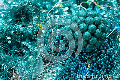 New Year or Christmas decorations of turquoise color: tinsel, balls, garlands Stock Photo