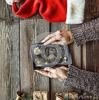 New Year, Christmas, Tablet computer, human hands, gift boxes, c Stock Photo