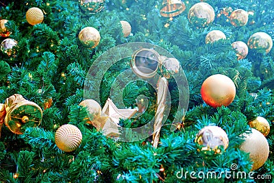 New year and Christmas tree decorations with Golden balls, candels and bells Stock Photo