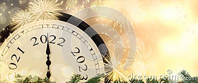 New Year 2022 clock and fireworks background. Stock Photo