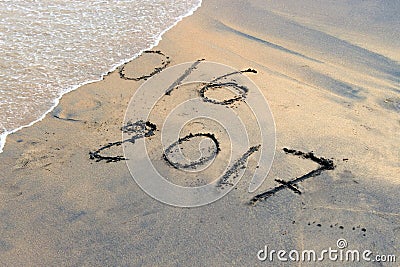 New Year 2017 is coming concept - inscription 2016 and 2017 on a beach sand Stock Photo