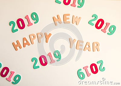 New Year composition with wooden 2019 numbers and letters. Happy New Year festive card. Stock Photo