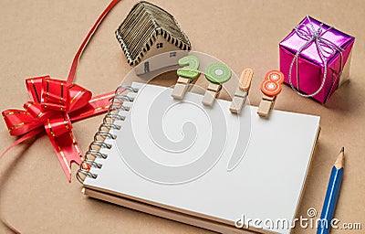 New year concepts,2018 on notebook,House model , gift , ribbon a Stock Photo