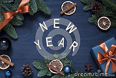 New Year dark blue flat lay with wooden letters. Winter holiday concept flat lay. Stock Photo