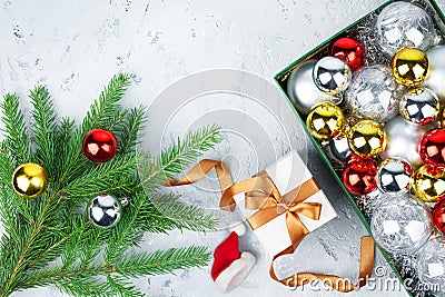 New Year decorative border, festive frame, Christmas tree glass balls decorations, green pine branches, gift box, gold ribbon Stock Photo