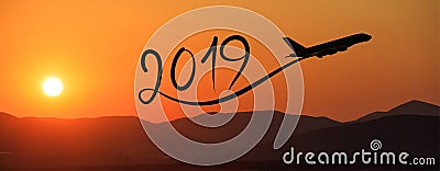 New year 2019 by flying airplane on the air at sunrise, banner Stock Photo