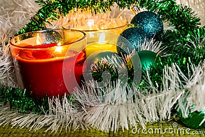 New year, green balls and decorations for the Christmas tree. Bright and beautiful scenery on a lemon background with white tinsel Stock Photo