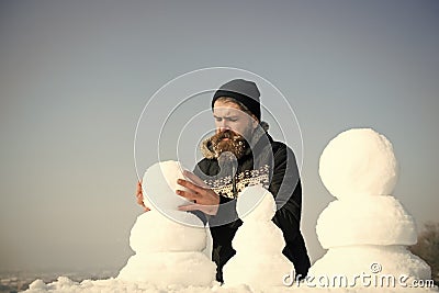 New year guy on blue sky with snow figure. Stock Photo