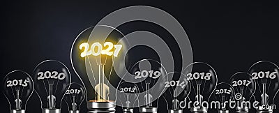 New year and idea bulbs. 2021 writing shines Stock Photo