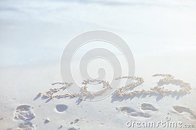 2023 new year inscription on sand at beach Stock Photo