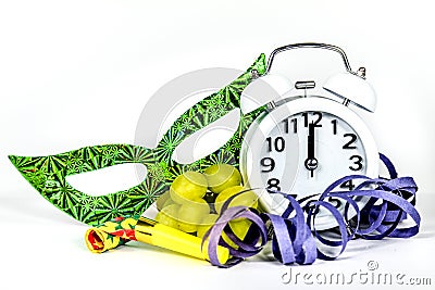 New Year at Midnight. Clock at twelve o'clock with party favors and grapes Stock Photo