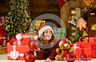 New year new goals. christmas present shopping. happy santa woman bear toy gift. decorative balls for holiday. boxing Stock Photo