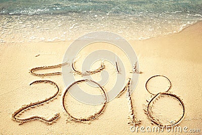 New Year 2018 replace 2017 on sea beach summer, New Year 2017 is coming concept. Closeup. Stock Photo