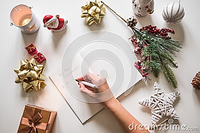 New year resolutions written with a hand on notebook with new years deco Stock Photo