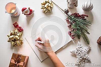 New year resolutions written with a hand on notebook with new years deco Stock Photo