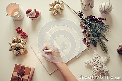 New year resolutions written with a hand on notebook with new years deco retro style Stock Photo