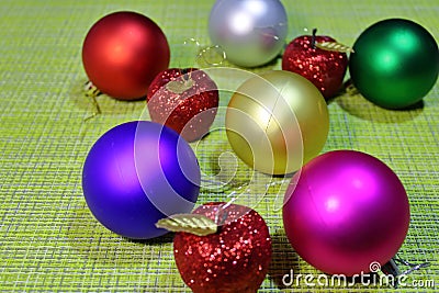 New Year`s ball for the Christmas tree on a green background. Stock Photo