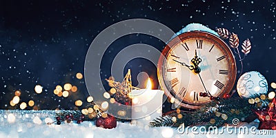 New Year`s clock. Decorated with balls, star and tree on snow Stock Photo