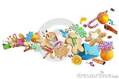 Gingerbread cookies and Christmas decorations laid out in the air isolated on white background Stock Photo