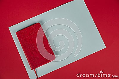 New Year`s decor on a red background. Christmas, holiday, give, count days, frame. flatlay. notebook, white sheet Stock Photo