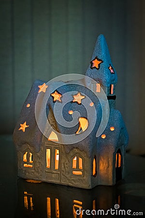 New Year`s house with a candle mysteriously look Stock Photo