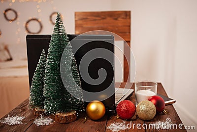 New Year`s interior, decoration of the desktop and bedroom for Christmas. Boke, lights, Christmas trees, balloons, a table with a Stock Photo