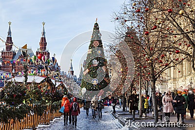 New Year`s Moscow, tourists on Red Square near the building of the Main Universal store Editorial Stock Photo
