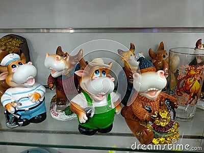 New Year& x27;s souvenirs on the shelf, different bulls Editorial Stock Photo