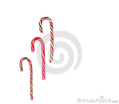 New Year's sticks candy canes with stripes on a white isolated background Stock Photo