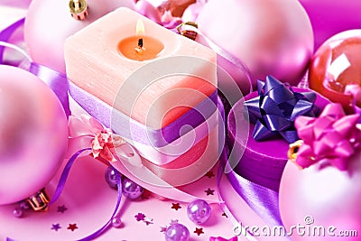 New Year's still-life with a candle in violet Stock Photo