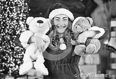 new year tips and ideas. happy girl at xmas party. christmas shopping sales. happy santa woman bear toy present. at the Stock Photo