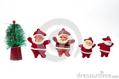 New year tree ornaments including a little Christmas tree and Santa Claus miniatures Stock Photo