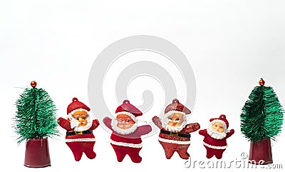 New year tree ornaments including little Christmas trees and Santa Claus miniatures Stock Photo