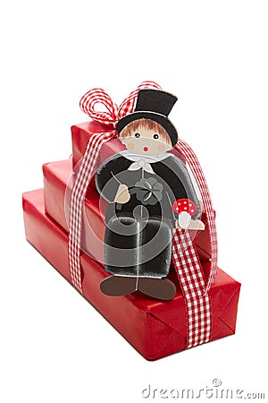 New Year wishes with chimney sweep and a red isolated present Stock Photo