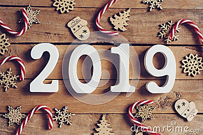 New year 2019 word and Christmas decoration on wooden table. Bus Stock Photo