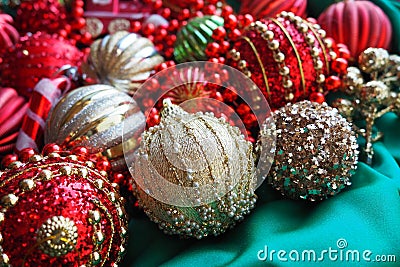 New Year's Christmas balls, tinsel and decorations close up. A lot of decoration of golden, red, yellow, green Stock Photo