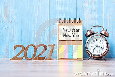 2021 New Year New Yoy with blank notebook, retro alarm clock and wooden number. New Start, Resolution, Goals, Plan, Action and Stock Photo