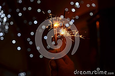 New years eve celebration with hand held sparkler fireworks Stock Photo