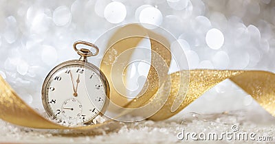 New Years eve countdown. Minutes to midnight on an old watch, bokeh festive background Stock Photo