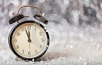 New Years eve countdown. Minutes to midnight on a vintage alarm clock Stock Photo