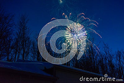New Years Eve fireworks in winter sky Stock Photo